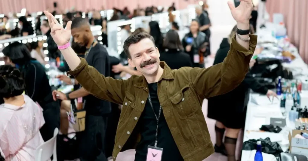 Adam Selman posing backstage at the 2026 Victoria’s Secret Fashion Show.