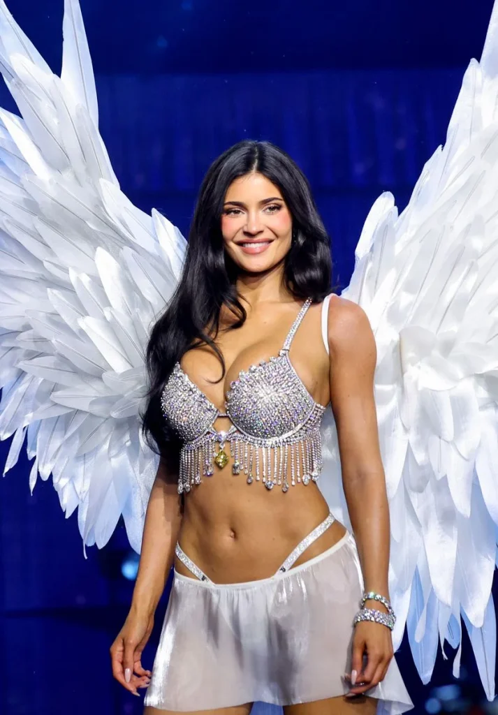 Celebrity guests wearing designer outfits and sunglasses at the 2026 Victoria’s Secret Fashion Show.