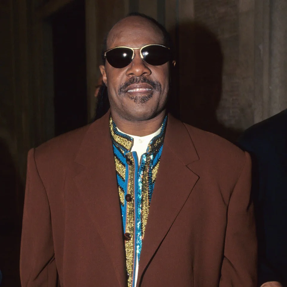 Stevie Wonder wearing sunglasses at Pavarotti and Friends in 1998